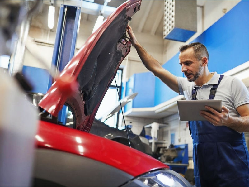 Mechanic inspecting engine